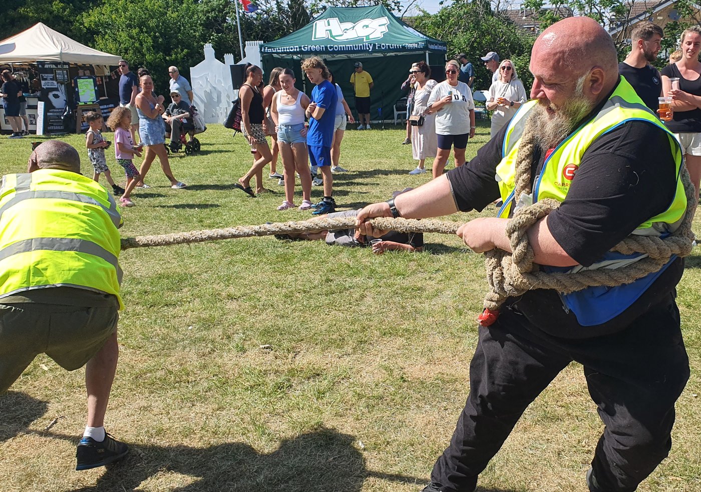 Kevin Stanley taking part in a tug-of-war at a VE Day community celebration